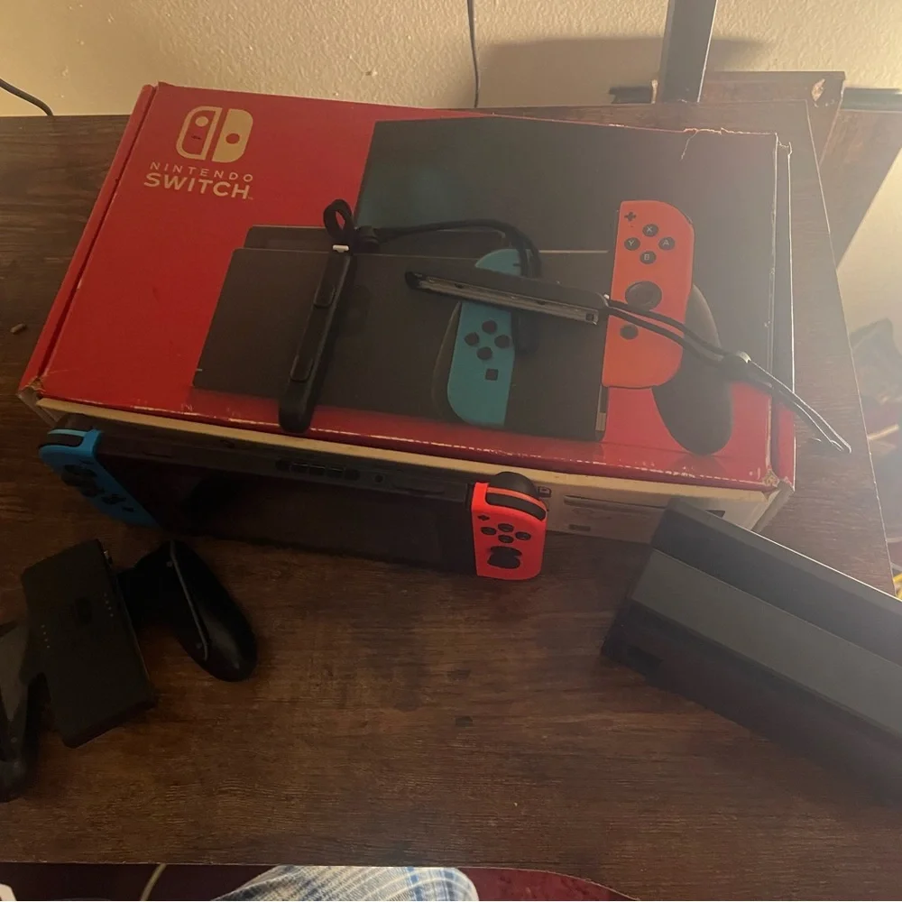 Nintendo Switch Console with Red and Blue Controllers
